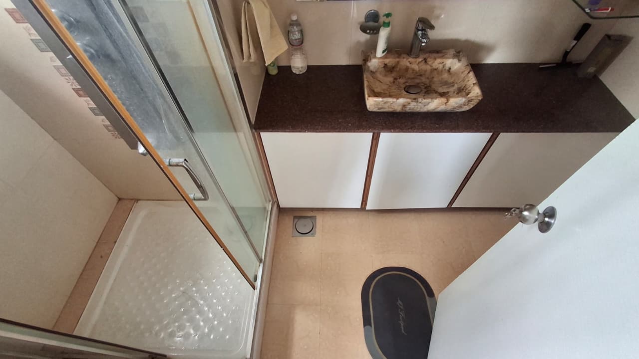 Attached washroom with shower enclosure