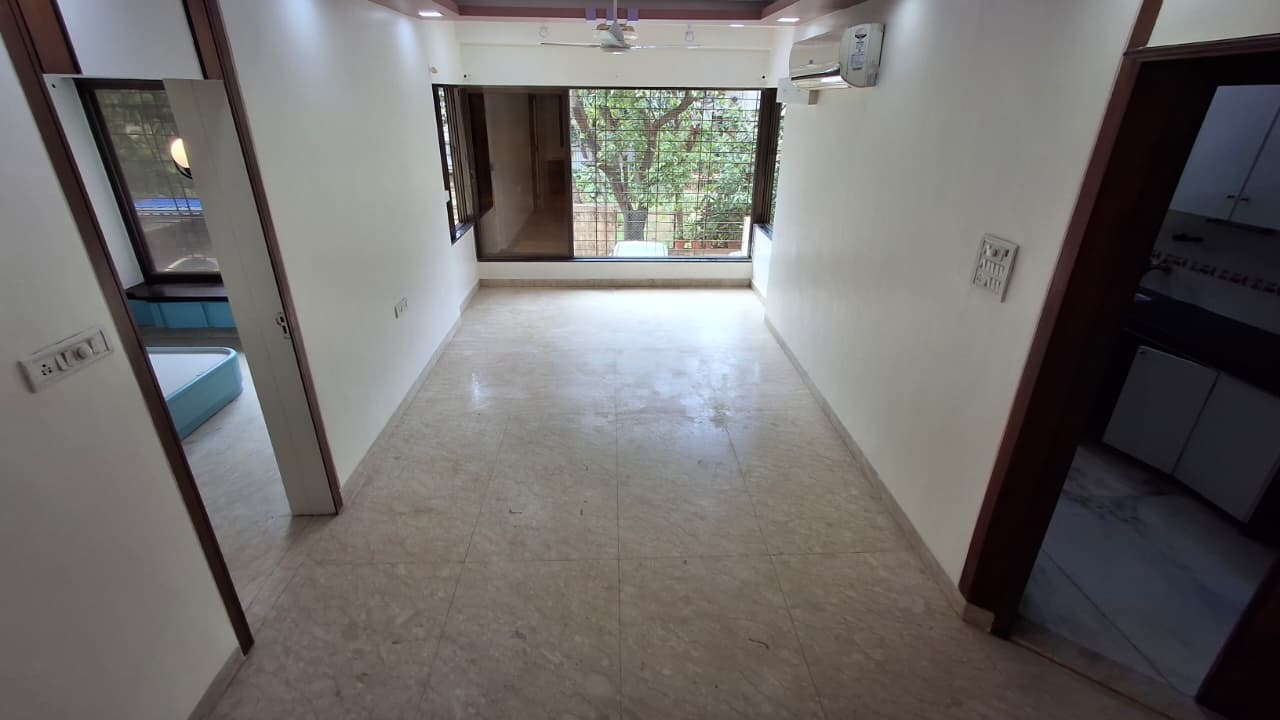 Living room with green views in the Silver Beach 2 BHK