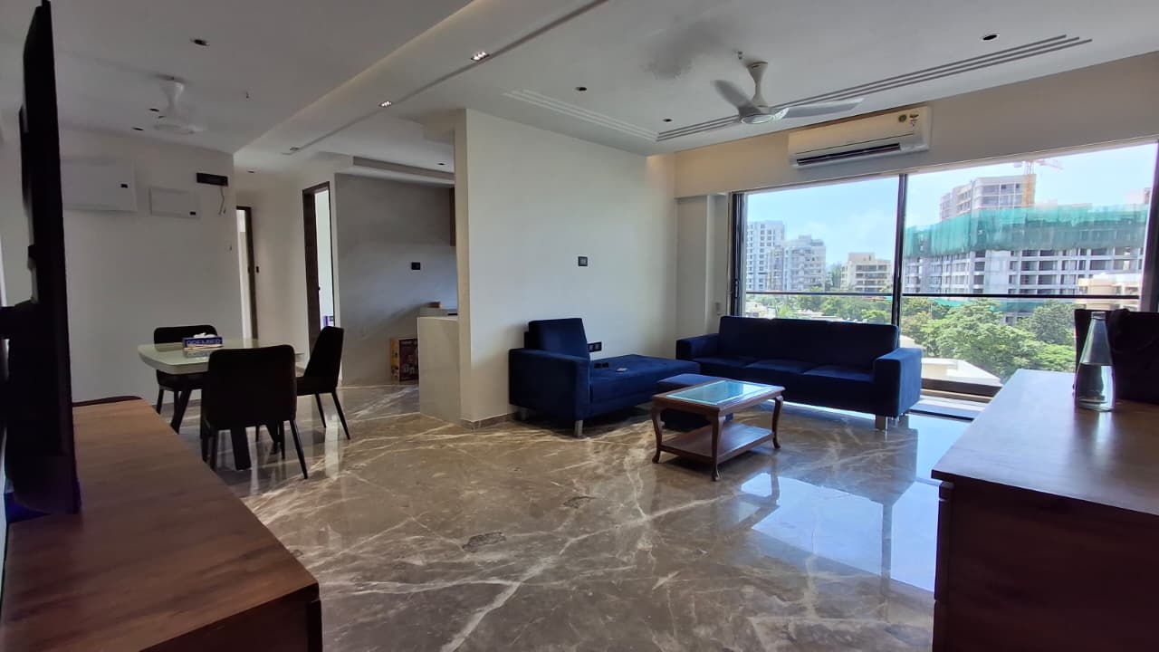 Fully furnished living and dining area in Juhu Gulmohar