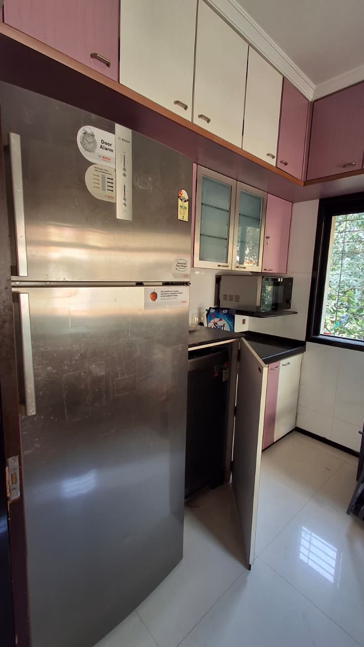 Kitchen with storage and PNG connection in Andheri West rental flat