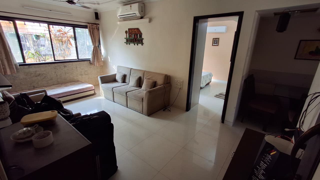Living room of fully furnished 2 BHK flat for rent near RTO Andheri West